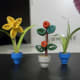Plant the flowers in the pots.