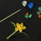 Glue the flower and leaves to a toothpick.