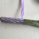 Continue weaving until the flowers are covered. Then wrap the ribbon around the stems.
