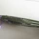 Gently bend the stems over the flowers to form a cage.