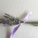 Tie the flower stems with the ribbon.