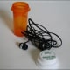 Ear bud headphones fit right in pill bottles. This will keep them from getting tangled and/or lost in your backpack, purse, etc.