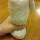Fill with cotton balls up to heel of the sock to create the head of the snowman.