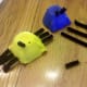 Insert 3 black pipe cleaners in the holes for the legs and 2 shorter black pipe cleaners for the antennas.