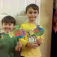 My boys proudly showing off their coffee filter fish!