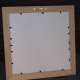 An extra layer of foam-core over the back of the cross stitch for protection.