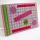 Layered with pink scrapbook paper.