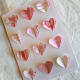 Gluing a single heart and then sewing a second heart down the center on top of the first one creates a 3D effect.