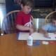 Use glue to attach paper strips to inside of letter outline.