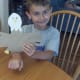 My son proudly displaying his handprint eagle.