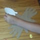 Cut out head shape from white construction paper and attach to top of footprint.