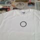 Dip top of small jar in the black paint and print first ring near the top center of the front of the t-shirt.