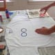 Wash and dry jar, then dip in red paint to print the third ring.