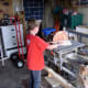 Using the disc sander to sand the edges of each piece as well as the dowel ends.