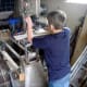Drilling the hold for the handle to fit into. A hand drill will work as well, although care must be taken to keep the drill vertical to the workpiece.