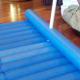 Half the last noodle and tie to both ends of the raft.