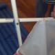 Use fishing line to attach the sail to the mast.