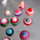 Button rings in progress on one of my gluing cookie sheets.