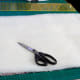 Cut quilt padding to match the size of the pillow front.