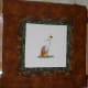 The finished patchwork frame around the cross stitch.