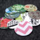 Small floral stone circles and larger circles ready to go. I have a mix of scrapbook paper, sheet music printed on card stock, and photos printed on card stock.