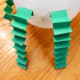 Bend pieces of construction paper back and forth to create arms and legs and tape to balloon.