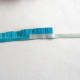 Attach a thin quilling paper strip to the fringed paper