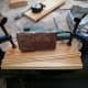 Sanding the cut edge straight and smooth with an electric sander