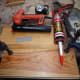 Fixing an end stop to the far edge of the wooden side panel with pins (nail gun) and glue