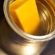 Put the wax into a large coffee can and, in turn, put the coffee can in a large pot. Fill it two inches deep.