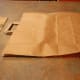 invert the paper bag inside out so the students can decorate it
