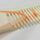 Insert quilling paper in between the prongs.