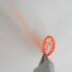 Wrap another strip of quilling paper around the coil. Use glue to stick the loose end onto the coil.