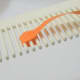 Use glue to hold end of paper.