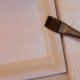 Tape paper to board, then use 1" brush to wet paper evenly with clear water.