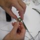 Coil the first group of pine needles into a circle, and wrap it with thread to start the pine needle basket.