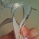 Make a loop with the other side of the long piece of ribbon.