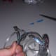 Hold all strands together in the center.