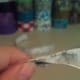 Pinch the center of the ribbon together