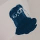 Gently tap the stamped sheet to knock off any remaining loose powder.