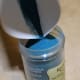 Fold the spare sheet of paper to create a quick funnel for returning unused powder to the embossing powder container.