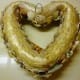 Back of straw wreath with wire inserted and made into a hanger. Shells are hot glued on the front and sides of the wreath leaving the back plain.