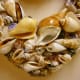 Closeup of shells layered onto the seashell wreath