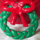 Ornament made by braiding lengths of dough and then adding a dough ribbon on the top.