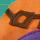 Sew pieces onto the front piece of the toy's body fabric.