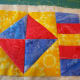 Layer the pieces and quilt. This mug rug is quilted along the seams.