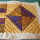 This mug rug is quilted along the seams and then in a more intricate pattern, using the sewing foot as a guide.