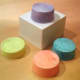 Colored with Sharpies and pressed with the side of my hand, these pillbox K-cup hats look like they've been watercolored.