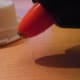 … and hot glue the brim pieces into place, creating small circles.