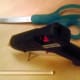 Sharp scissors (smaller is better) and a glue gun are needed